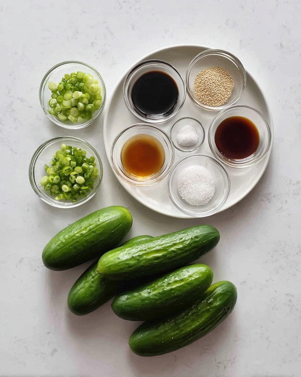 The image shows seven small fresh green cucumbers arranged in a loose cluster at the bottom on a white marbled surface. To the upper right of the cucumbers, there is a round white plate holding seven small clear glass bowls, each containing a different ingredient: dark soy sauce, light brown liquid, translucent clear liquid, white coarse salt, light brown sesame seeds, white fine sugar, and minced garlic. To the left side of the plate, there is an extra small clear bowl filled with chopped green onions. The setup is neat and organized, showcasing the ingredients clearly and simply. Photo taken with an iphone --ar 4:5 --v 7