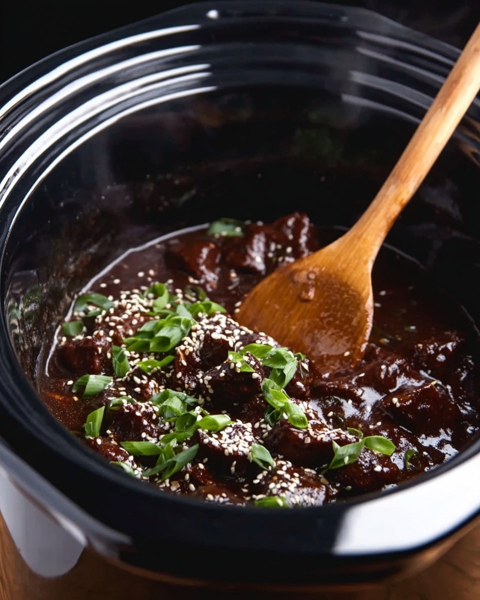 Inside a black slow cooker, there is a dark brown sauce with chunks of meat fully covered in it. The dish is topped with white sesame seeds and fresh green onion slices scattered over the food. A wooden spoon is stirring the pieces, showing the sauce's glossy and thick texture. The slow cooker has a shiny black rim and slight steam rising inside. photo taken with an iphone --ar 4:5 --v 7