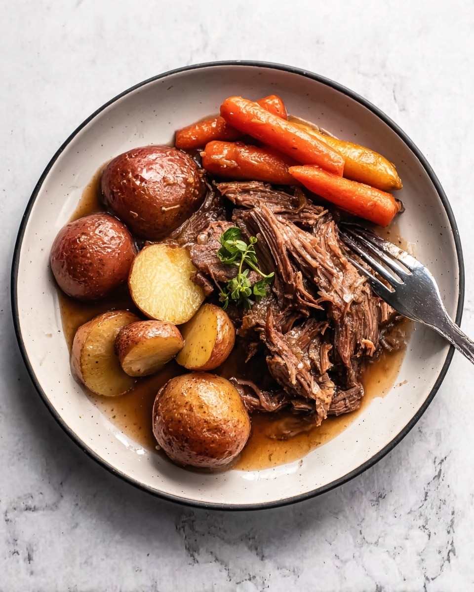 A white plate with a thin black rim holds a serving of cooked meat, torn into soft, dark brown pieces covered in shiny gravy. Around the meat are several small round potatoes with a reddish-brown skin, some cut in half showing a yellow inside, and bright orange whole baby carrots. A fresh green herb garnish is placed on top. A metal fork is positioned on the right side of the plate, resting slightly on the food. The background is a white marbled surface. photo taken with an iphone --ar 4:5 --v 7