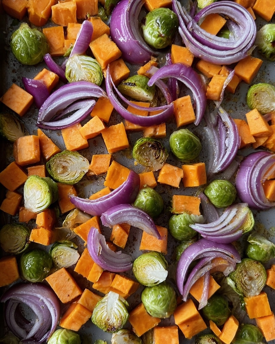 This image shows a mix of roasted vegetables scattered on a gray baking tray. The main layers include bright orange cubes of sweet potato spread evenly across the tray. Interspersed among the sweet potatoes are green halved Brussels sprouts with slightly browned edges, showing some roasting. Thin curved slices of purple onion are laid on top, adding contrast with their light inner rings and darker purple outer edges. The texture of the vegetables varies from smooth soft cubes to slightly crispy Brussels sprouts and delicate, almost translucent onion slices. The overall color palette includes warm orange, fresh green, and cool purple tones on a gray base. Photo taken with an iphone --ar 4:5 --v 7