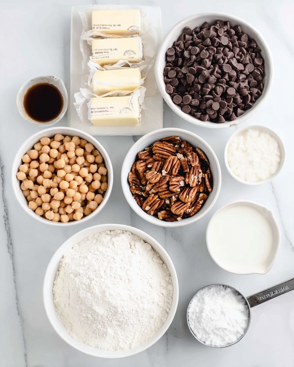 The image shows several white bowls and containers arranged on a white marbled surface with baking ingredients. In the top right, a white bowl is half filled with dark brown chocolate chips and half with light to medium brown pecan nuts. Beside it, three sticks of butter wrapped in light cream paper sit side by side. Below the pecans and chocolate, there is a white bowl filled with light brown chickpeas. To the left, a large white bowl holds white flour, next to a smaller white bowl with white sugar. Above the sugar, a small white bowl contains a dark brown liquid, and next to it is a white bowl with cream or milk. In the lower right corner, a metal measuring cup filled with white powder, likely baking powder, rests on the surface. The scene is bright and clean, clearly showing the textures of each ingredient. Photo taken with an iphone --ar 4:5 --v 7