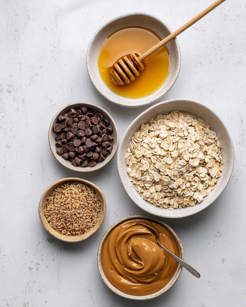 The image shows five white bowls placed on a white marbled surface. The biggest bowl on the right side is filled with light beige oat flakes, having a rough texture and slightly uneven edges. Above it, there is a medium-sized bowl with golden honey and a wooden honey dipper resting inside, the honey looks smooth and shiny. To the left of the honey, a smaller bowl holds dark brown chocolate chips, small and round with a matte finish. Below the chocolate chips, another small bowl contains a coarse light brown flaxseed meal with a grainy texture. At the bottom, a small bowl is filled with smooth, glossy light brown peanut butter, with a spoon dipped halfway inside. photo taken with an iphone --ar 4:5 --v 7