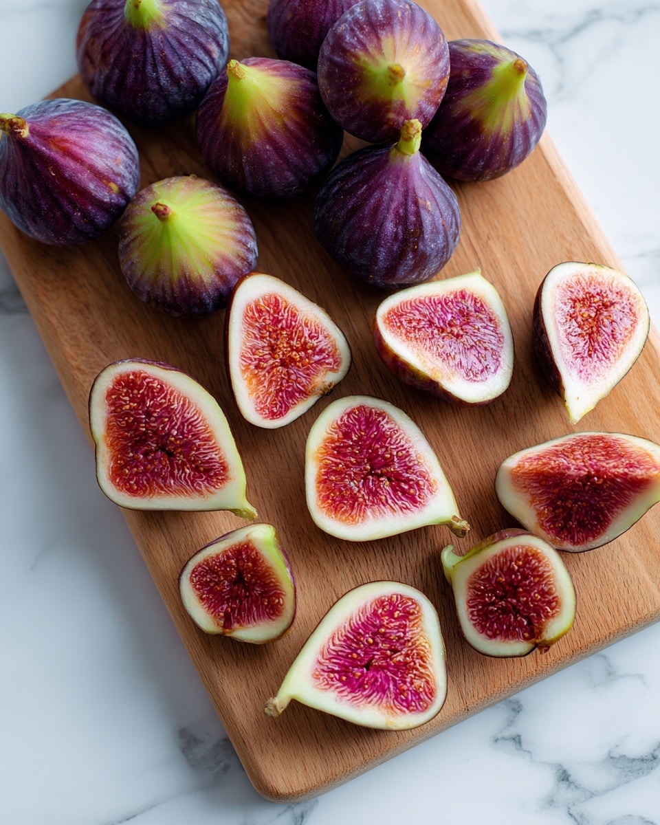 The image shows a wooden cutting board on a white marbled surface with fresh figs arranged on it. There are two types of figs: nine whole figs placed at the top left, showing their purplish skin with a greenish-yellow tip, and many fig halves spread over the rest of the board. The fig halves reveal bright red, juicy interiors with tiny seeds and a white outline near the skin. The colors contrast well between the dark purple skin and the rich red inside, with the natural texture of the wood visible under the fruit. Photo taken with an iphone --ar 4:5 --v 7