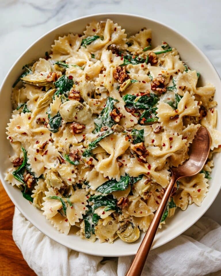 Creamy Pasta with Sun-Dried Tomatoes, Artichokes, Spinach, and Toasted Walnuts Recipe